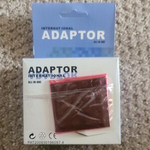 International All-in-One Adaptor. New In Box.